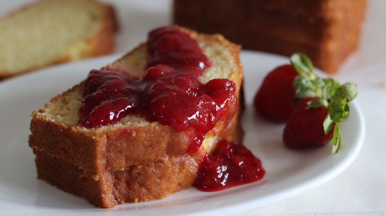 A pound cake sandwich covered in strawberry jam