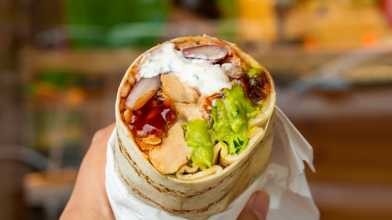 Someone holding a burrito