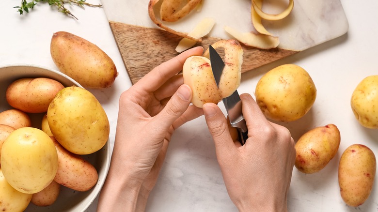 Peeling potato with a paring knife