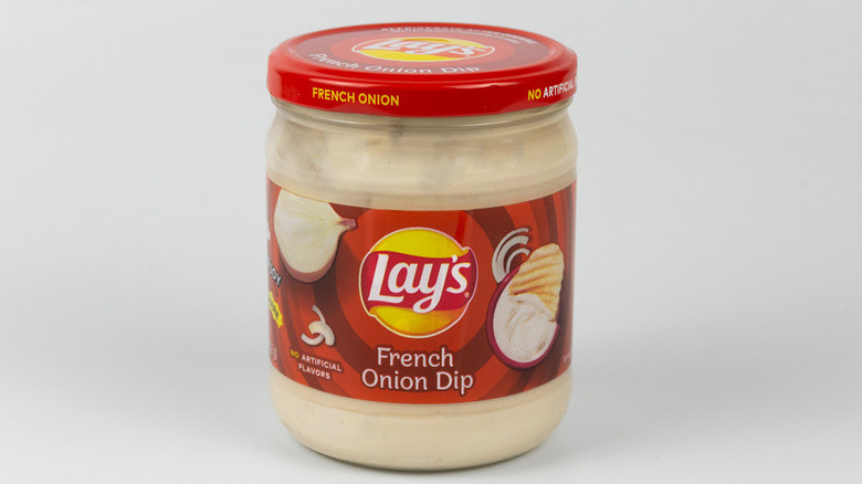 Jar of Lay's French onion dip on gray background