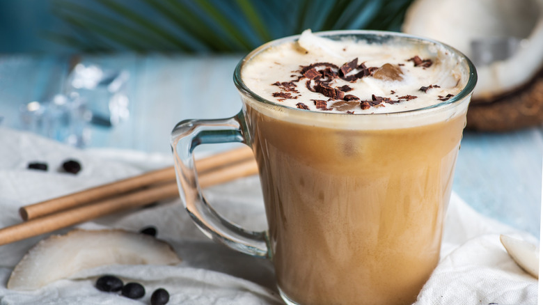 Coffee with coconut in background