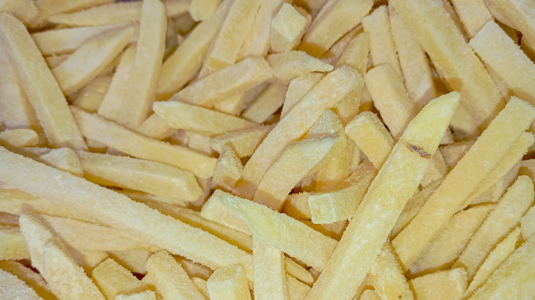 close up of pile of frozen French fries