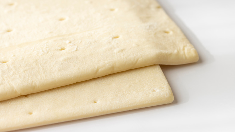 Defrosted puff pastry dough stacked on top of one another