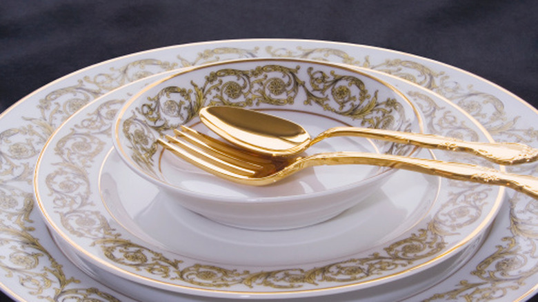 Limoges stacked plates with silverware