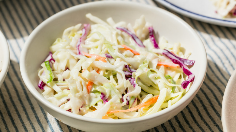 Coleslaw is in a bowl.