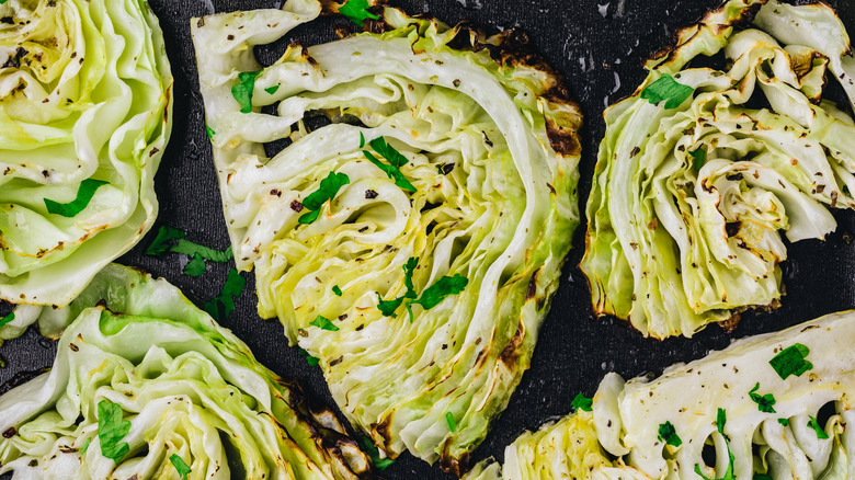 Roasted cabbage wedges on a baking tray