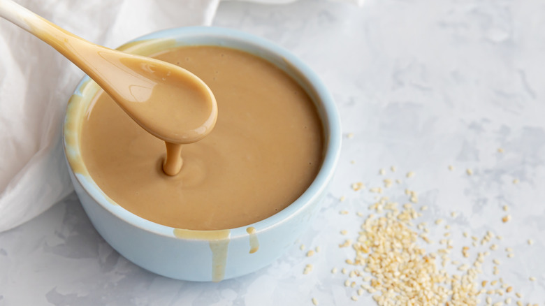 Tahini in a bowl with seeds