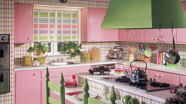 A green and pink vintage kitchen