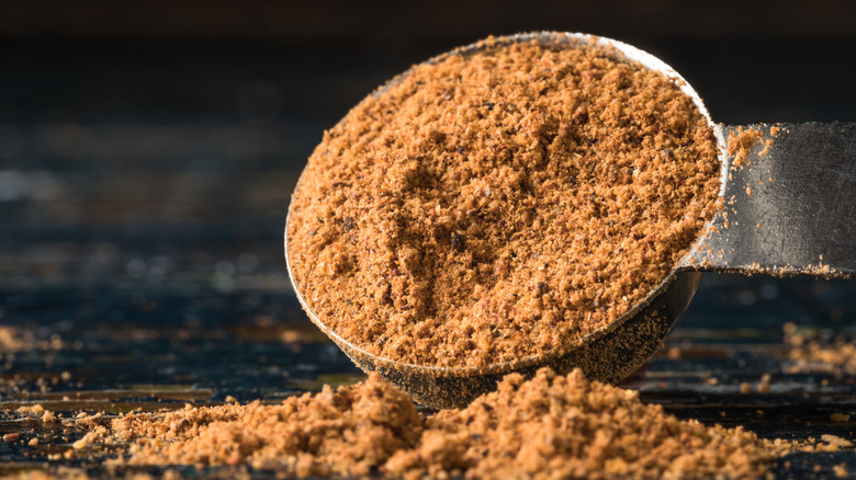 Jerk seasoning in a measuring spoon