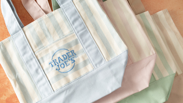 Array of pastel Trader Joe's tote bags