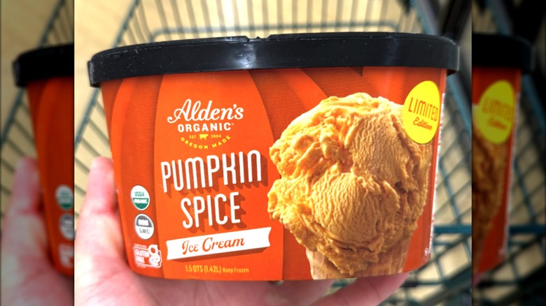 A hand holding a carton of Alden's Pumpkin Spice Ice Cream