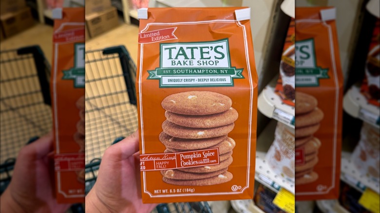 Hand holding bag of Tate's Bake Shop Pumpkin Spice Cookies