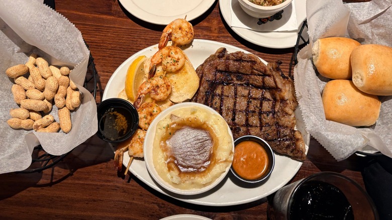 Top-view of a Texas Roadhouse dinner spread