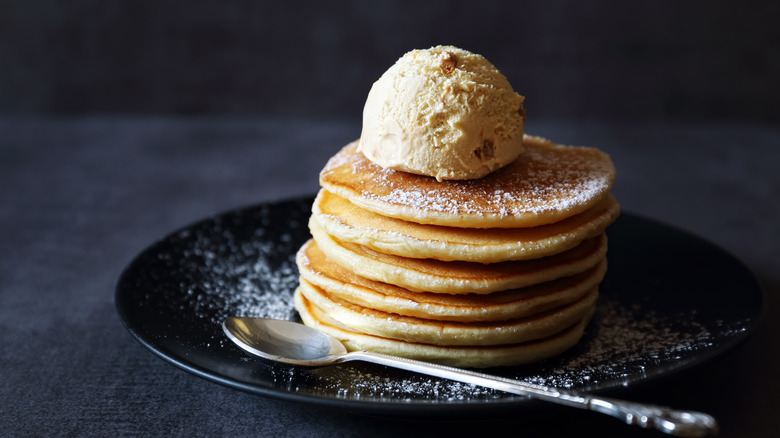 A plate of pancakes with ice cream