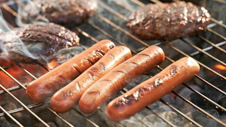 hot dogs on a grill
