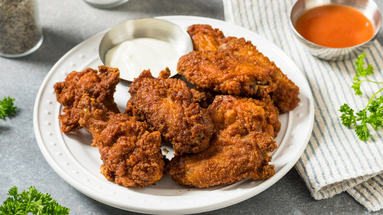 Fried chicken wings on plate