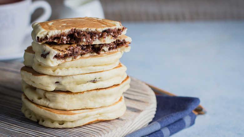 Closeup of stacked chocolate stuffed pancakes