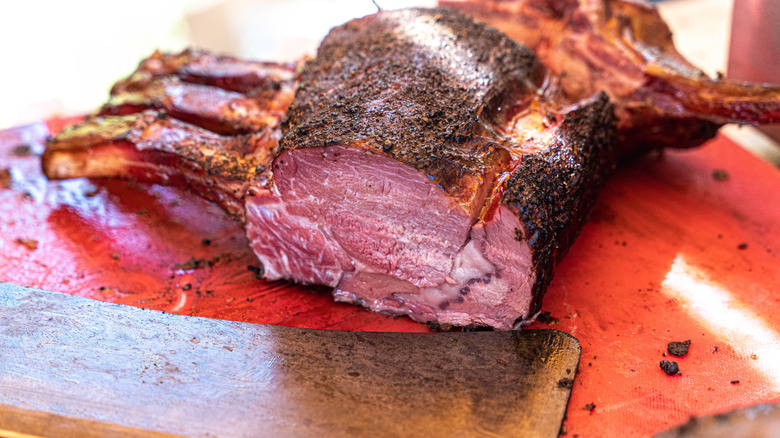 Closeup of smoked barbecue prime rib on a cutting board