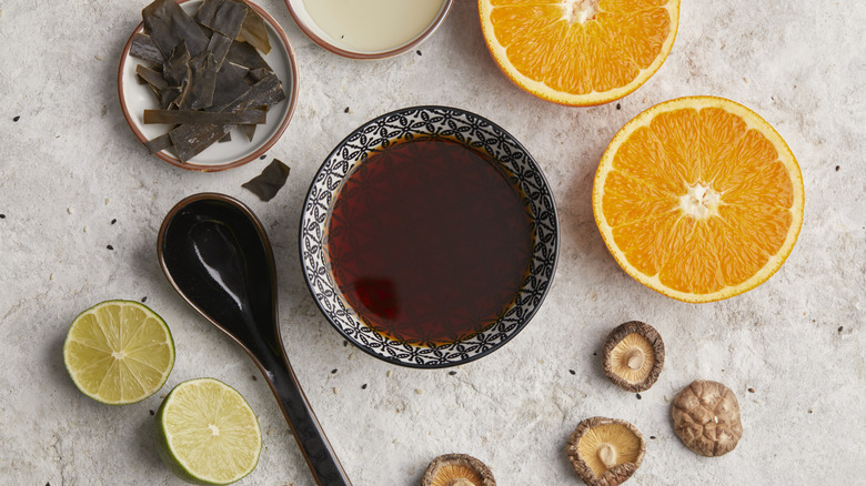 a bowl of ponzu sauce and some of its ingredients