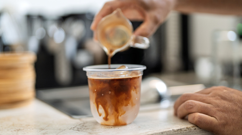 sweetening coffee with syrup