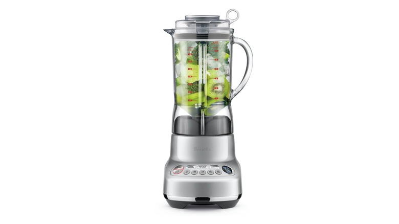 A beauty shot of Breville's the Fresh and Furious blender, filled with kiwi and broccoli, on a white background