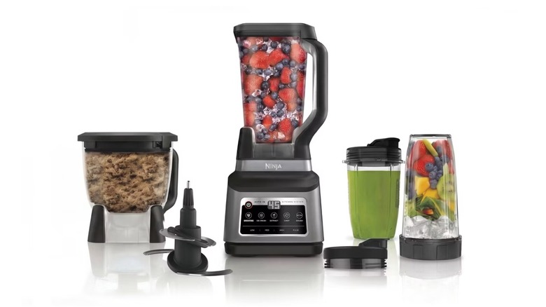 A beauty shot of the Ninja Professional Plus Premier Blender and Food Processor, two 24 ounce to-go cups, 8 cup processor bowl, and blade on a white background