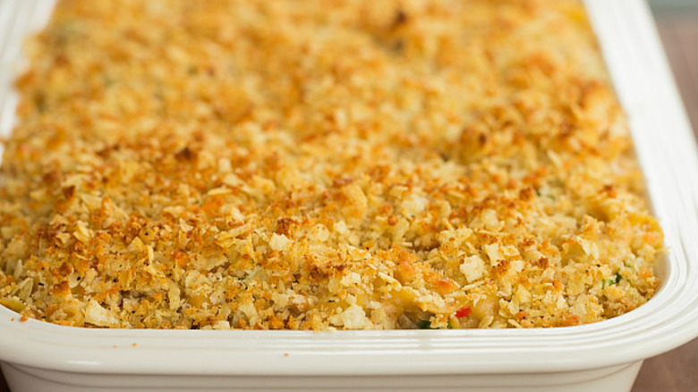 Crispy-topped scalloped cabbage casserole in a white baking dish