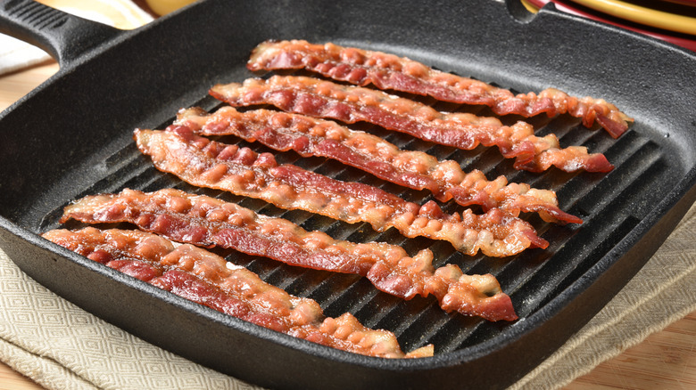 Slabs of bacon on skillet