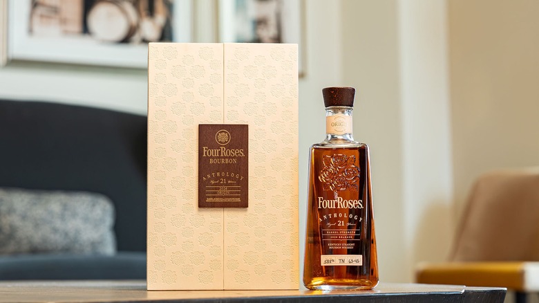 Four Roses Chapter One: Origin bourbon case and bottle ste on table