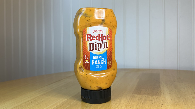 Bottle of Frank's RedHot Dip'n Buffalo Ranch on wooden table