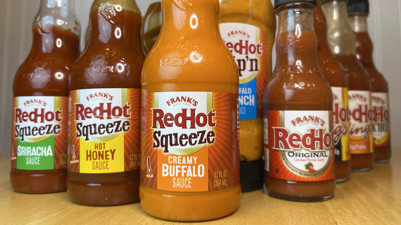 Close up of Frank's RedHot sauces arranged on table