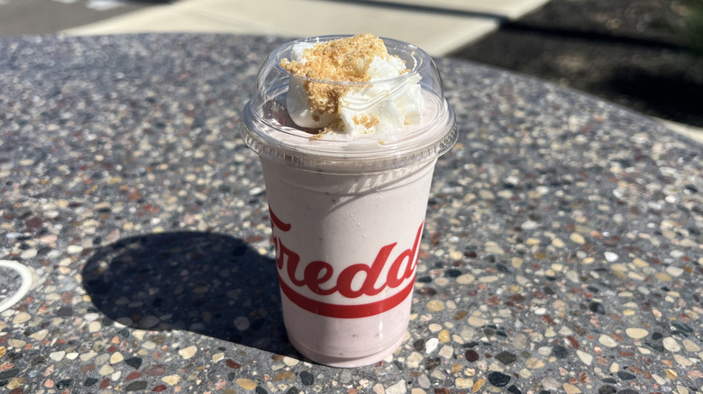 Freddy's Strawberry Dreamcake Concrete on an outside table