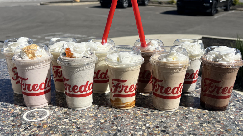 10 Freddy's Concretes and milkshakes on an outside table