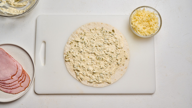 Mayonnaise spread across tortilla