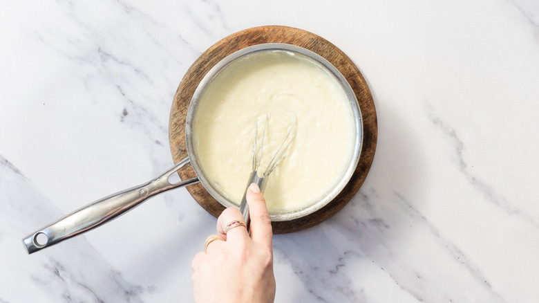 Whisking bechamel sauce