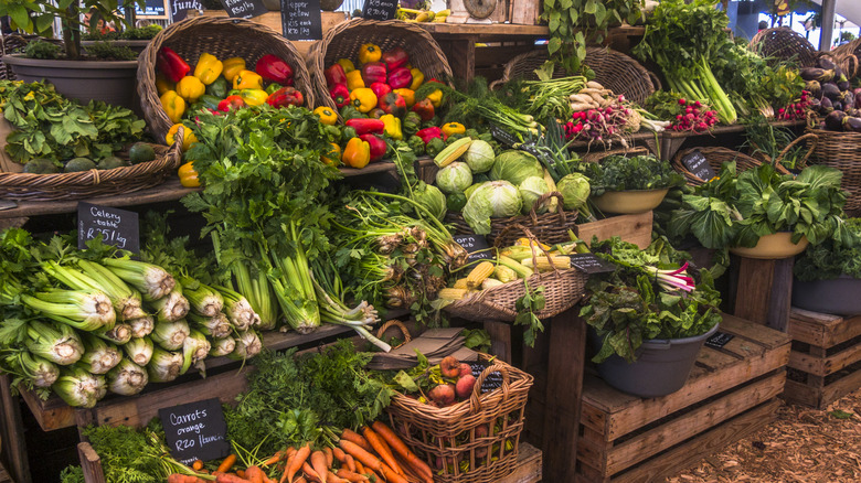 A fruit and vegetable stand at a farmers market