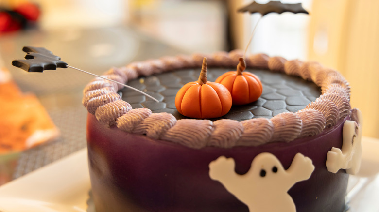 Chocolate cake with fondant ghosts, pumpkins, and bats