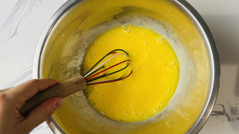 Whisking eggs in a bowl