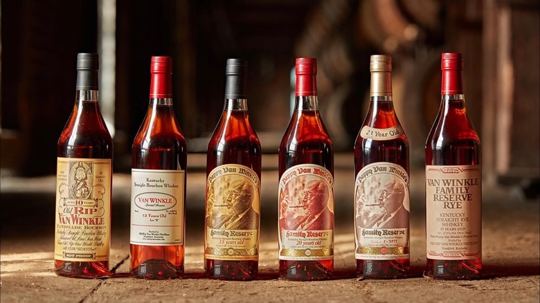 A line-up of six different bottles of Pappy Van Winkle posed on the warehouse floor