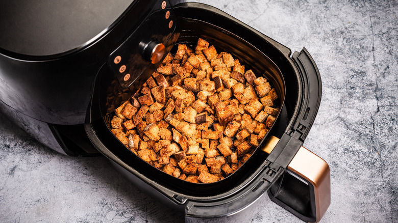 Croutons being made in an air fryer