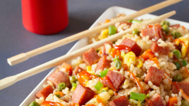 Fried rice with SPAM and pineapple on a table