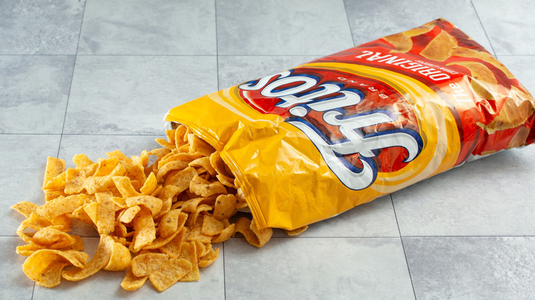 bag of fritos spilled onto tile
