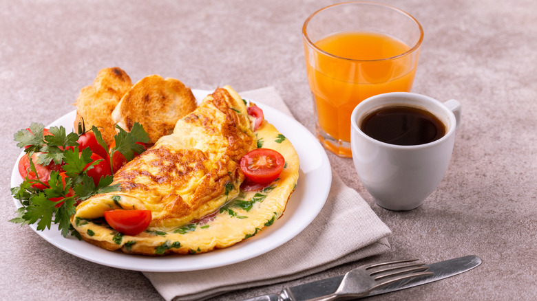 Omelet breakfast with coffee and orange juice