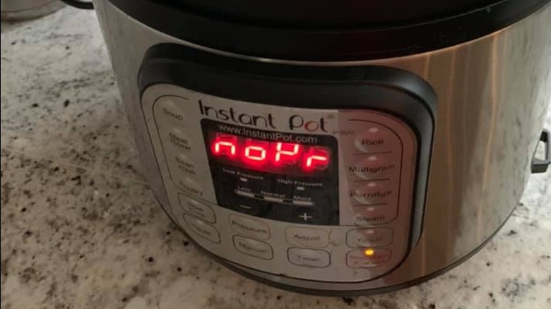 An Instant Pot displaying the error code NoPr on the screen