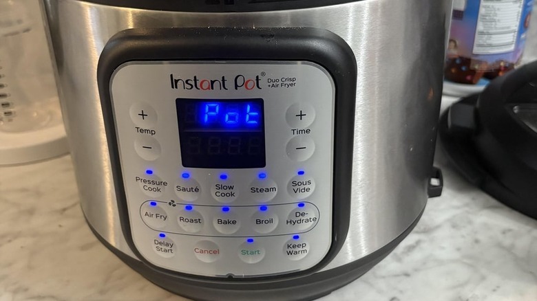 A close-up of an Instant Pot Duo Crisp + Air Fryer with the error code pot
