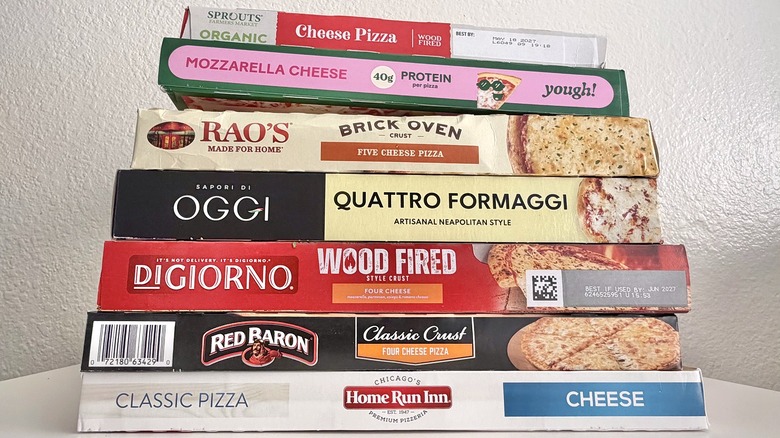 Pizza boxes stacked on top of each other.