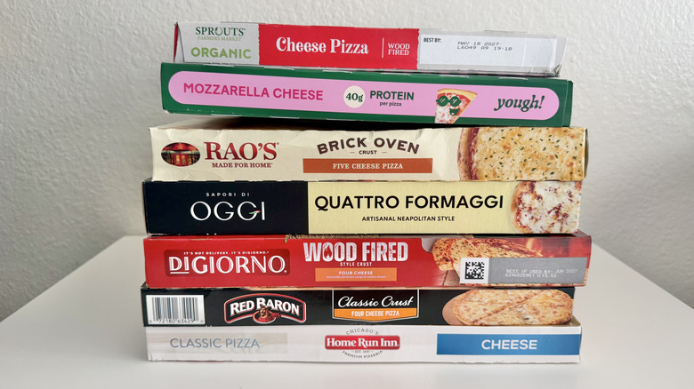 Pizza boxes stacked on top of each other on a table