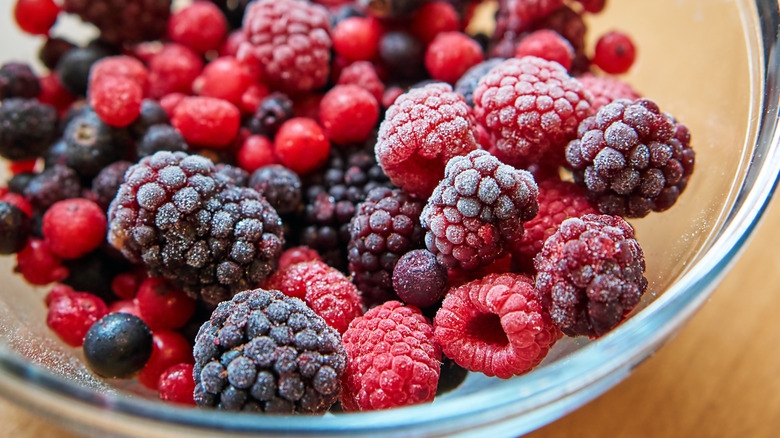 Frozen berries in glass bowl