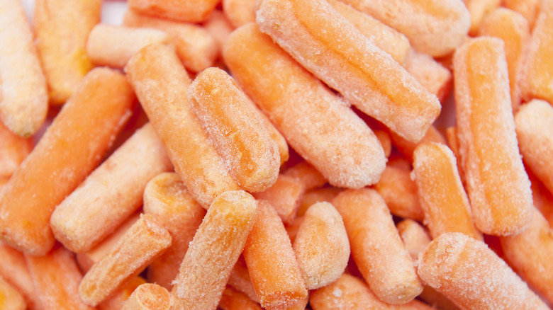 Close up of frozen baby carrots
