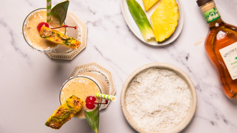 Overhead view of hummingbird cocktails with toppings.